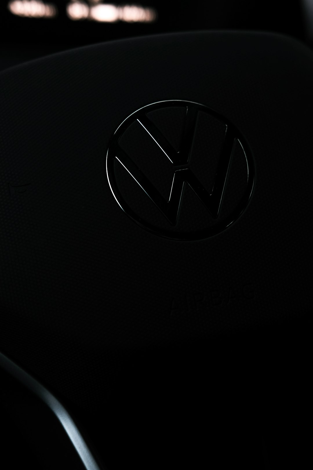 a-close-up-of-a-volkswagen-emblem-on-a-car-tlzfaoegkos